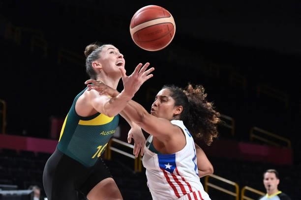 Australia's Katie Ebzery and Puerto Rico's Jennifer O'neill fight fight for the ball in the women's preliminary round group C basketball match...