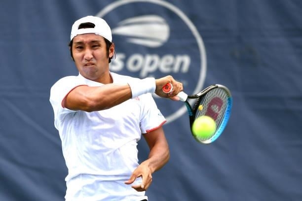 Yasutaka Uchiyama of Japan returns a shot during a match against Andreas Seppi of Italy on Day 3 during the Citi Open at Rock Creek Tennis Center on...