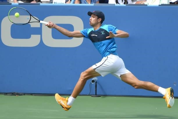 Daniel Elahi Galán of Colombia returns a shot during a match against Tommy Paul of the United States on Day 3 during the Citi Open at Rock Creek...