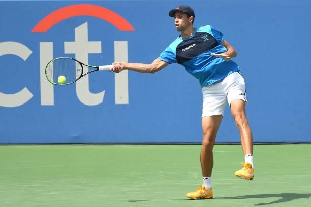 Daniel Elahi Galán of Colombia returns a shot during a match against Tommy Paul of the United States on Day 3 during the Citi Open at Rock Creek...
