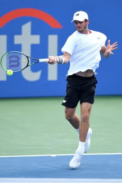 Tommy Paul of the United States returns a shot during a match against Daniel Elahi Galán of Colombia on Day 3 during the Citi Open at Rock Creek...