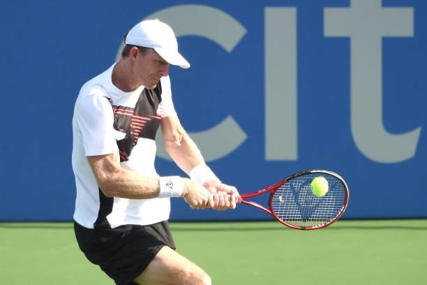Kevin Anderson of South Africa returns a shot against Jenson Booksby of the United State on Day 3 during the Citi Open at Rock Creek Tennis Center on...