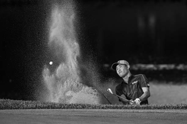 Collin Morikawa of Team USA plays a shot from a greenside bunker on the 18th hole during a playoff in the final round of Mens Individual Stroke Play...