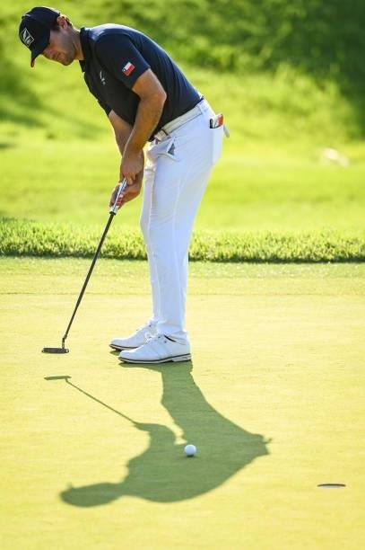 Mito Pereira of Team Chile putts through his shadow on the 10th hole green during a playoff in the final round of Mens Individual Stroke Play Golf on...