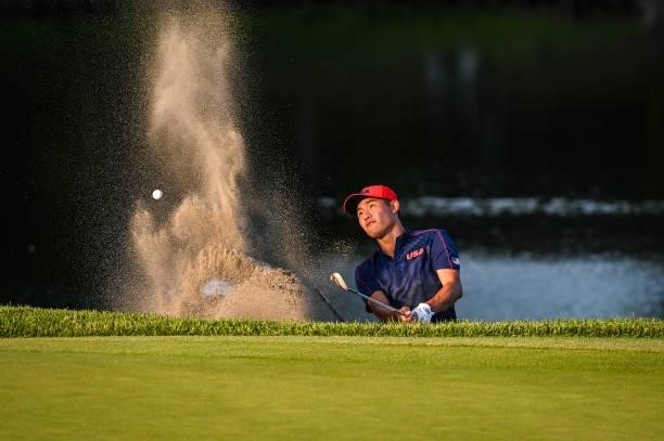 Collin Morikawa of Team USA plays a shot from a greenside bunker on the 18th hole during a playoff in the final round of Mens Individual Stroke Play...
