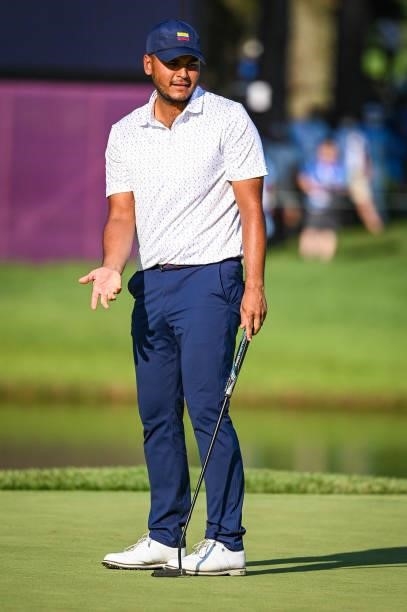 Sebastian Munoz of Team Colombia reacts to missing a birdie putt on the 18th hole green during a playoff in the final round of Mens Individual Stroke...