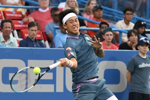 Kei Nishikori of Japan returns a shot against Sam Querrey of the United States on Day 3 of the Citi Open at Rock Creek Tennis Center on August 2,...