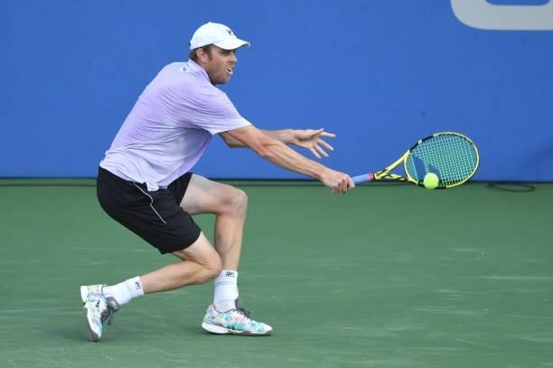 Sam Querrey of the United States returns a shot against Kei Nishikori of Japan on Day 3 of the Citi Open at Rock Creek Tennis Center on August 2,...
