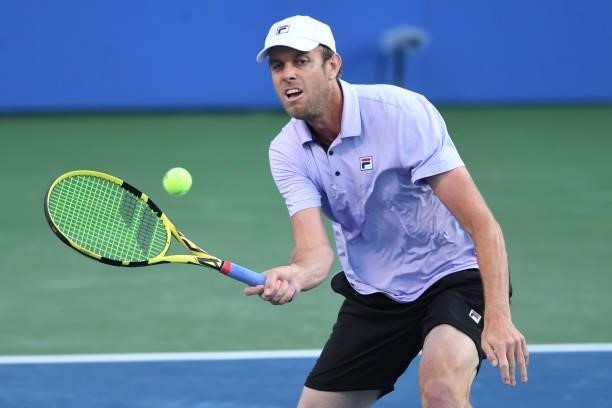 Sam Querrey of the United States returns a shot against Kei Nishikori of Japan on Day 3 of the Citi Open at Rock Creek Tennis Center on August 2,...