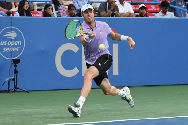 Sam Querrey of the United States returns a shot against Kei Nishikori of Japan on Day 3 during the Citi Open at Rock Creek Tennis Center on August 2,...