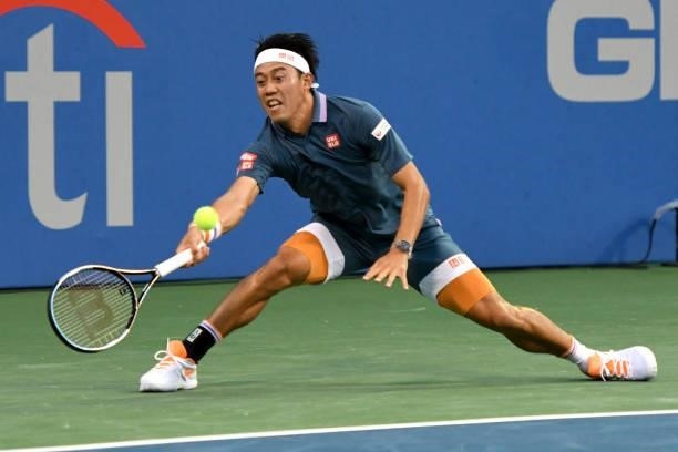 Kei Nishikori of Japan returns a shot against Sam Querrey of the United States on Day 3 during the Citi Open at Rock Creek Tennis Center on August 2,...