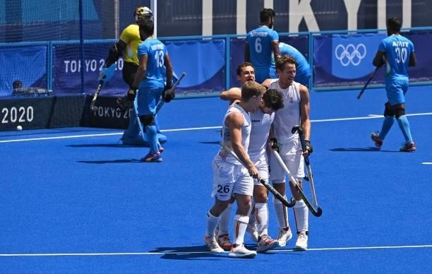 Belgium's Loick Fanny Luypaert celebrates with teammates after scoring against India during their men's semi-final match of the Tokyo 2020 Olympic...