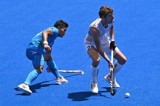 Belgium's Antoine Sylvain Kina is challenged by India's Nilakanta Sharma during their men's semi-final match of the Tokyo 2020 Olympic Games field...