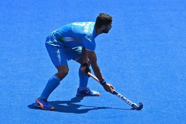 India's Rupinder Pal Singh looks to make a pass during the men's semi-final match of the Tokyo 2020 Olympic Games field hockey competition against...
