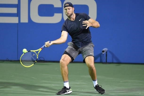 Jack Sock of the United States returns a shot against Yoshihito Nishioka of Japan on Day 3 of the Citi Open at Rock Creek Tennis Center on August 2,...