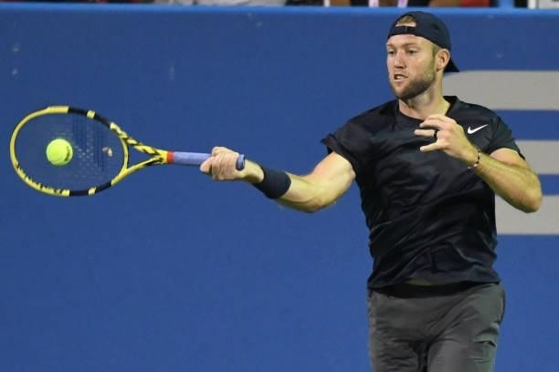 Jack Sock of the United States returns a shot against Yoshihito Nishioka of Japan on Day 3 of the Citi Open at Rock Creek Tennis Center on August 2,...
