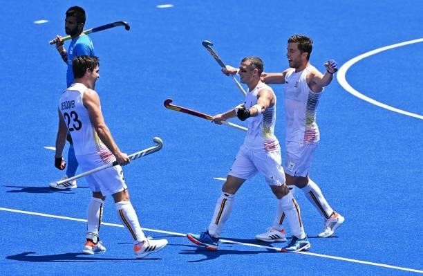 Belgium's Arthur Anne-Marie Thierry De Sloover, John-John Dominique Dohmen and Cedric Daniel Andre Charlier celebrate after defeating India 5-2 in...