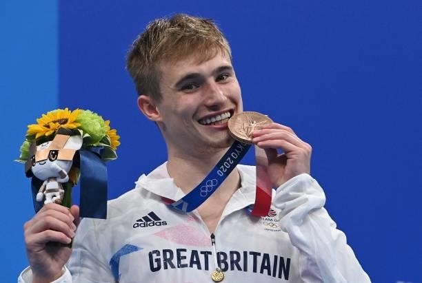 Bronze medallist Britain's Jack Laugher poses with their medal after the men's 3m springboard diving final event during the Tokyo 2020 Olympic Games...
