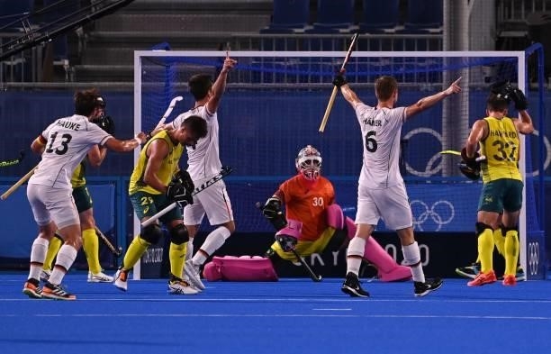 Germany's Lukas Windfeder celebrates after scoring against Australia during their men's semi-final match of the Tokyo 2020 Olympic Games field hockey...