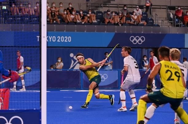 Australia's Flynn Andrew Ogilvie strikes the ball during the men's semi-final match of the Tokyo 2020 Olympic Games field hockey competition against...