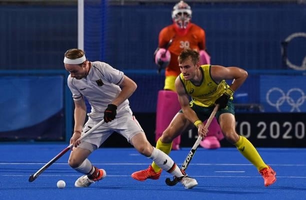 Germany's Jan Christopher Ruhr is marked by Australia's Joshua Simmonds during their men's semi-final match of the Tokyo 2020 Olympic Games field...