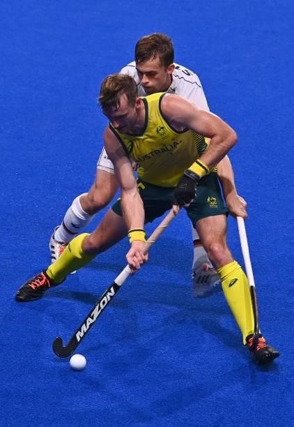 Australia's Joshua Simmonds is marked by Germany's Constantin Staib during their men's semi-final match of the Tokyo 2020 Olympic Games field hockey...