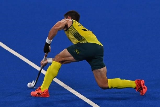 Australia's Jeremy Thomas Hayward passes the ball during the men's semi-final match of the Tokyo 2020 Olympic Games field hockey competition against...