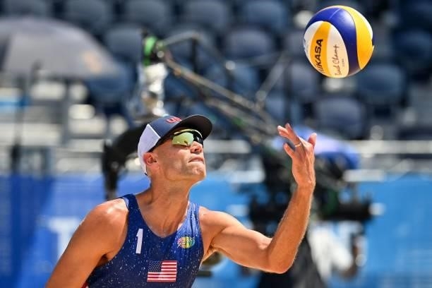 S Philip Dalhausser prepares to serve in their men's beach volleyball round of 16 match between Qatar and the USA during the Tokyo 2020 Olympic Games...
