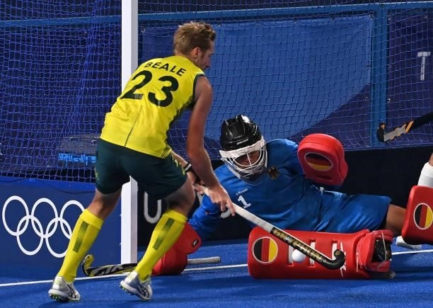 Australia's Daniel James Beale vies for the ball with Germany's goalkeeper Alexander Stadler during their men's semi-final match of the Tokyo 2020...
