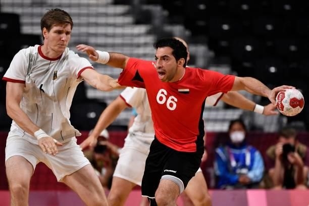 Germany's left back Finn Lemke challenges Egypt's right back Ahmed Elahmar during the men's quarterfinal handball match between Germany and Egypt of...