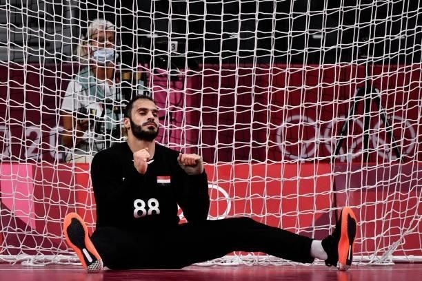 Egypt's goalkeeper Karim Hendawy reacts during the men's quarterfinal handball match between Germany and Egypt of the Tokyo 2020 Olympic Games at the...