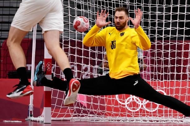 Germany's goalkeeper Andreas Wolff tries to stop a shot during the men's quarterfinal handball match between Germany and Egypt of the Tokyo 2020...