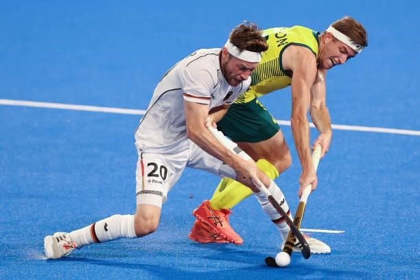 Martin Detlef Zwicker of Team Germany and Jacob Thomas Whetton of Team Australia battle for the ball during the Men's Semifinal match between...