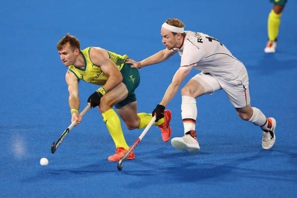 Joshua Simmonds of Team Australia and Jan Christopher Ruhr of Team Germany battle for the ball during the Men's Semifinal match between Australia and...