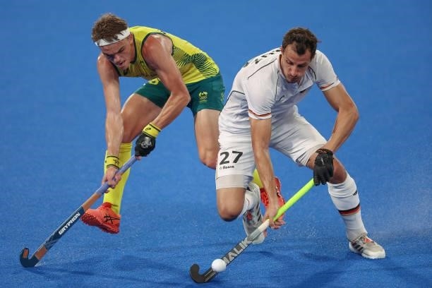 Timur Oruz of Team Germany and Tim Howard of Team Australia battle for the ball during the Men's Semifinal match between Australia and Germany on day...