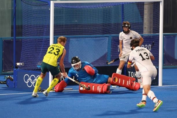 Daniel James Beale of Team Australia vies for the ball with Germany's goalkeeper Alexander Stadler during the Men's Semifinal match between Australia...