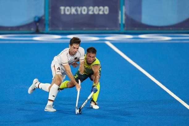 Lukas Windfeder of Team Germany and Tim rand of Team Australia battle for the ball during the Men's Semifinal match between Australia and Germany on...
