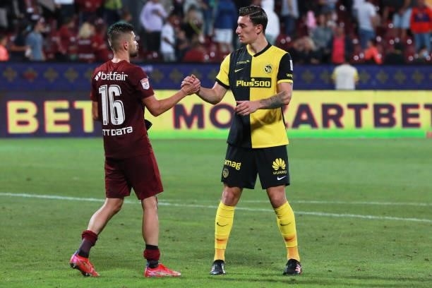 Ionut Costache of CFR Cluj and Jordan Lefort of Young Boys greet each other after the UEFA Champions League Third Qualifying Round Leg One match...