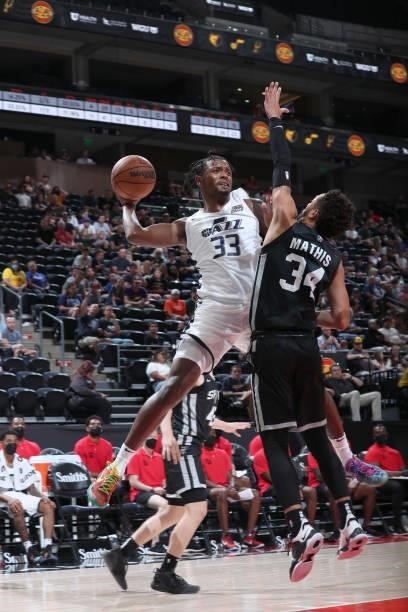 Elijah Hughes of the Utah Jazz White passes the ball against the San Antonio Spurs during the 2021 Salt Lake City Summer League on August 3, 2021 at...