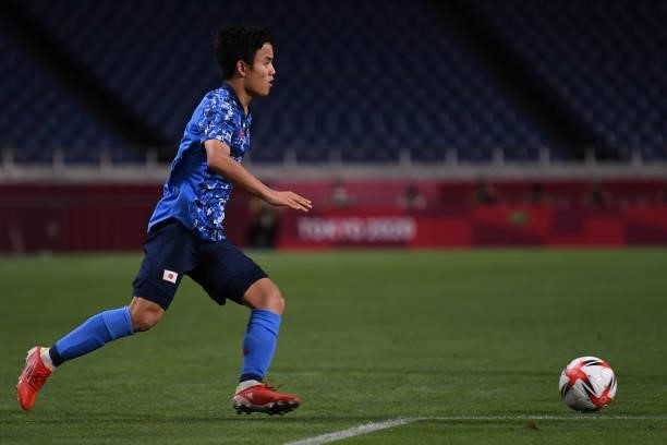 Takefusa Kubo of Japan dribbles the ball at Saitama Stadium on August 3, 2021 in Saitama, Japan.