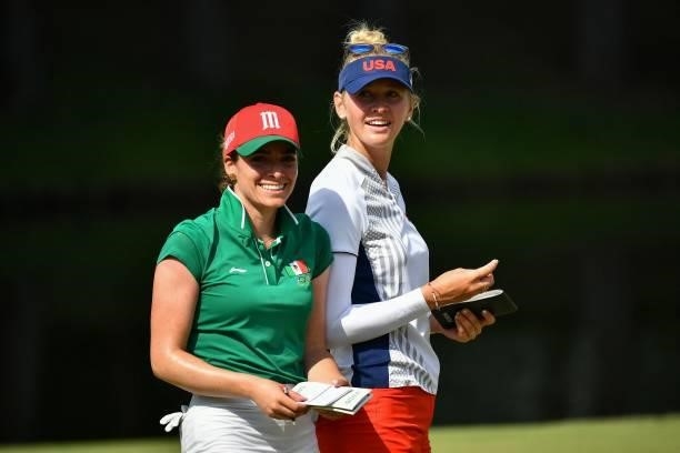 S Jessica Korda talks with Mexico's Gaby Lopez after round 1 of the womens golf individual stroke play during the Tokyo 2020 Olympic Games at the...