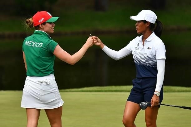 France's Celine Boutier greets Mexico's Gaby Lopez after round 1 of the womens golf individual stroke play during the Tokyo 2020 Olympic Games at the...