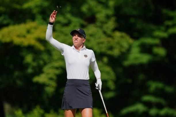 Germany's Sophia Popov checks the wind direction before teeing off from the 18th tee in round 1 of the womens golf individual stroke play during the...