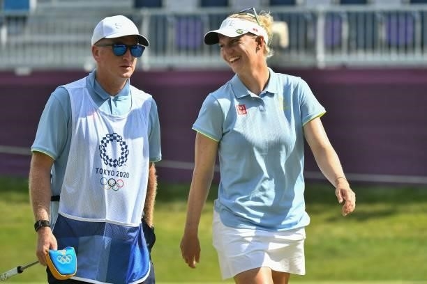 Sweden's Madelene Sagstrom talks with her caddie after round 1 of the womens golf individual stroke play during the Tokyo 2020 Olympic Games at the...