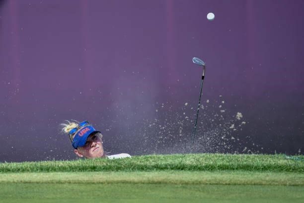 S Jessica Korda plays a shot out of the bunker on the 18th hole in round 1 of the womens golf individual stroke play during the Tokyo 2020 Olympic...