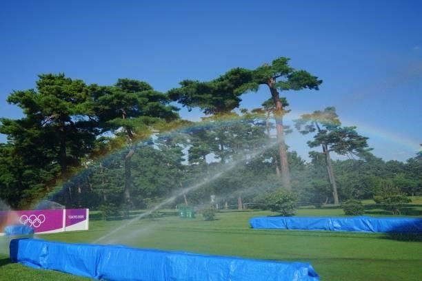 Rainbow is seen between sprinklers on the course on round 1 of the womens golf individual stroke play during the Tokyo 2020 Olympic Games at the...