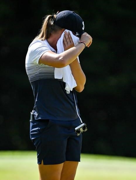 Saitama , Japan - 4 August 2021; Perrine Delacour of France cools down with a towel during round one of the women's individual stroke play at the...