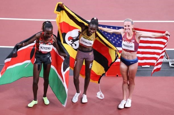 August 2021, Japan, Tokio: Athletics: Olympics, 3000m steeplechase, women, at the Olympic Stadium. Hyvin Kiyeng of Kenya, Peruth Chemutai of Uganda...