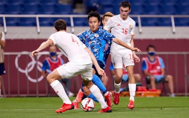 Takefusa Kubo of Japan and Pedri Gonzalez of Spain battle for the ball during the Men's Football Semi-final Match between Japan and Spain at Saitama...