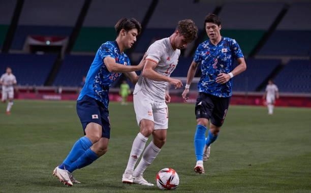 Ao Tanaka of Japan and Daiki Hashioka of Japan battle for the ball during the Men's Football Semi-final Match between Japan and Spain at Saitama...